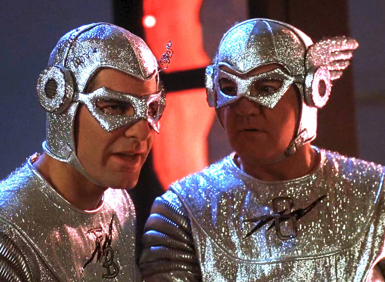 two men, Captain Galaxy and Future Boy, in shiny silver space suits