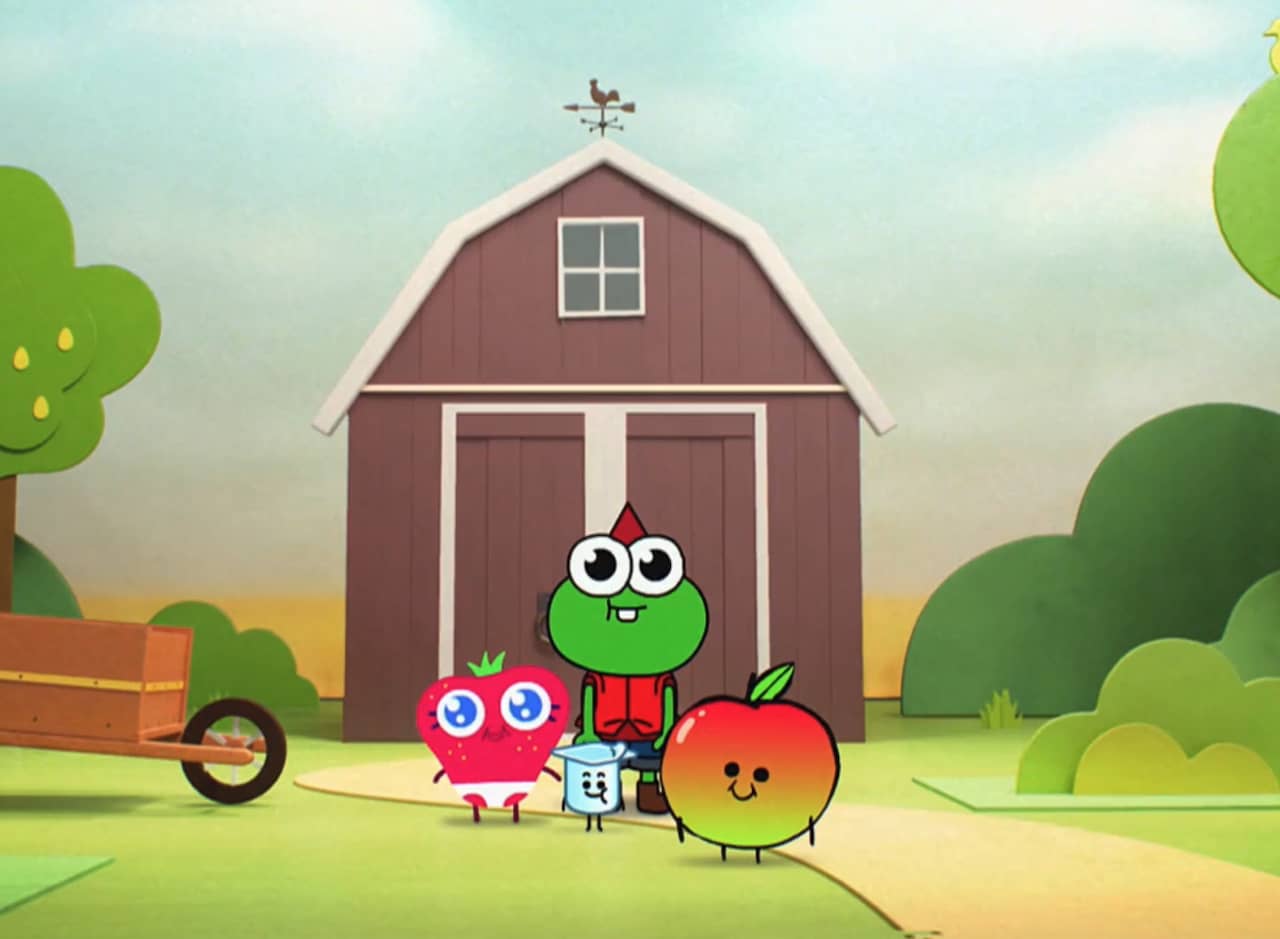 four kids in front of a barn: an apple, a yogurt cup, a strawberry, and a frog