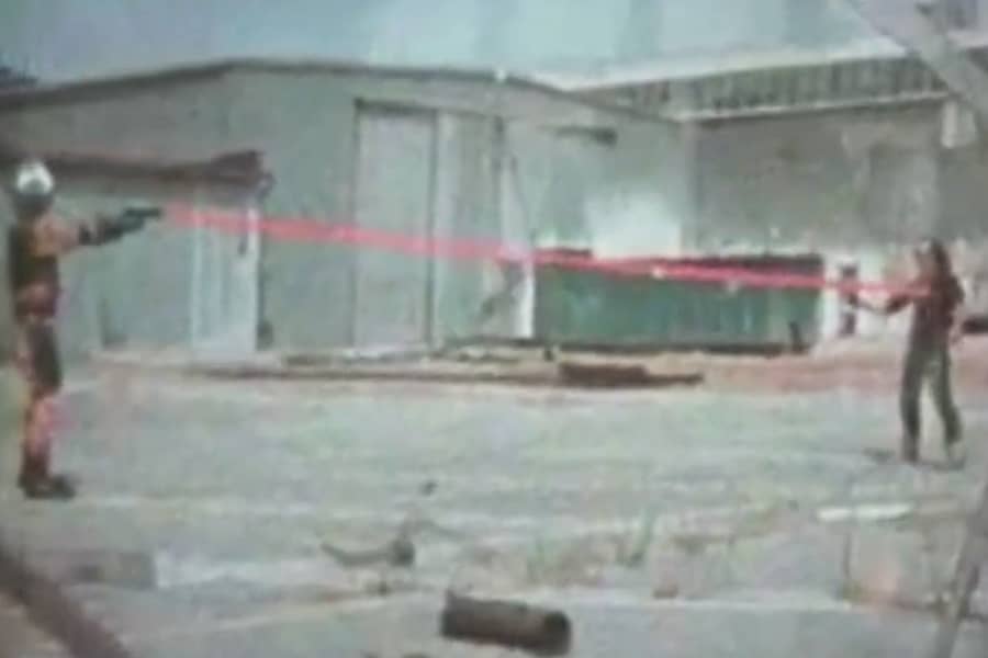 Lazer shooting a laser gun at the bad guy
