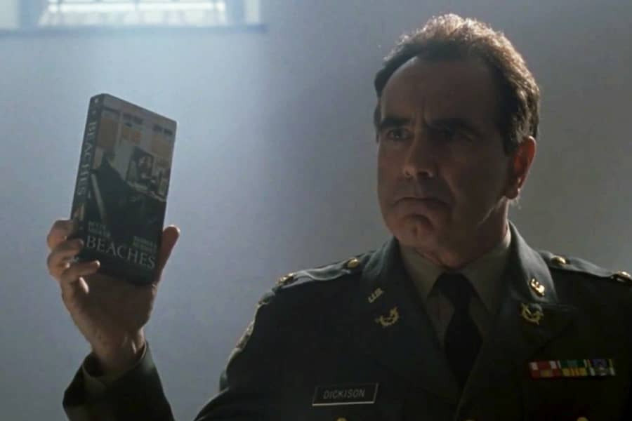 a general holds up a VHS copy of the movie Beaches
