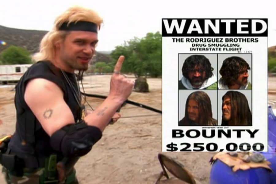 Tommy showing a wanted flyer on screen