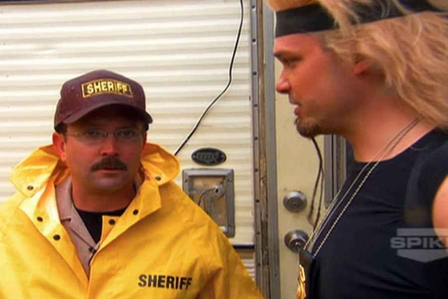 Tommy talking with the sheriff