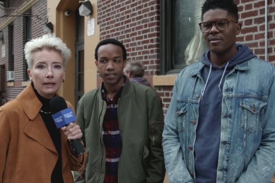 Newbury in her “White Savior” sketch talking to two Black men on the streets of New York