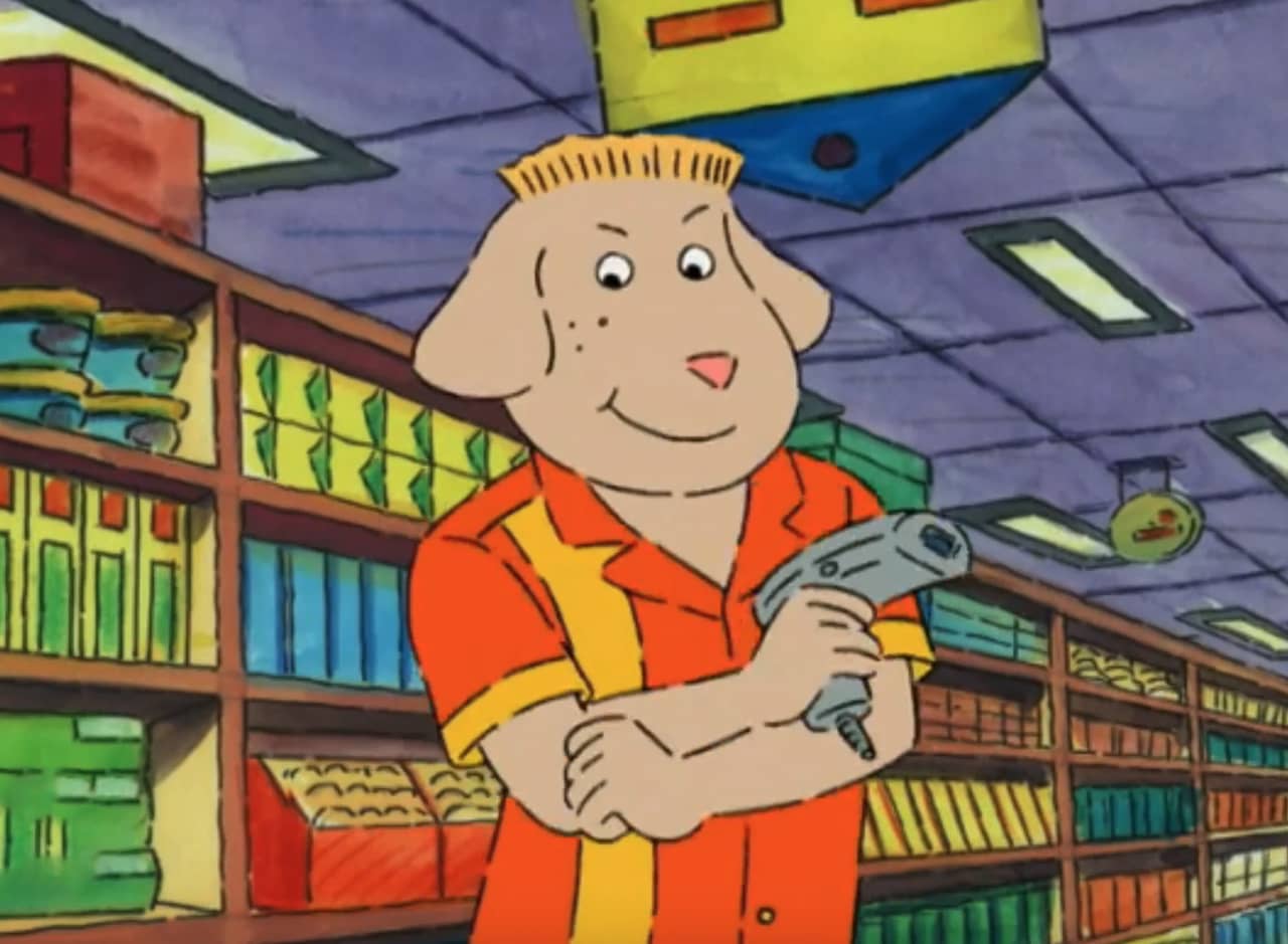 Benjamin in the supermarket aisle holding a price gun