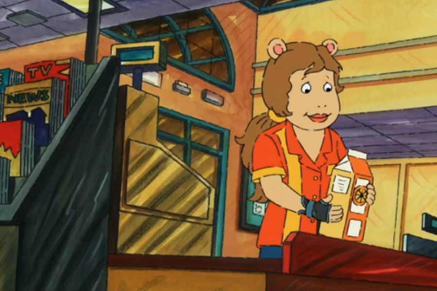 Lucie ringing up some milk at the register