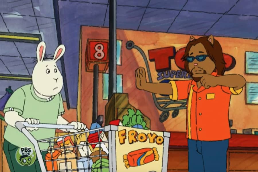 Jeff guiding a shopper with a full cart