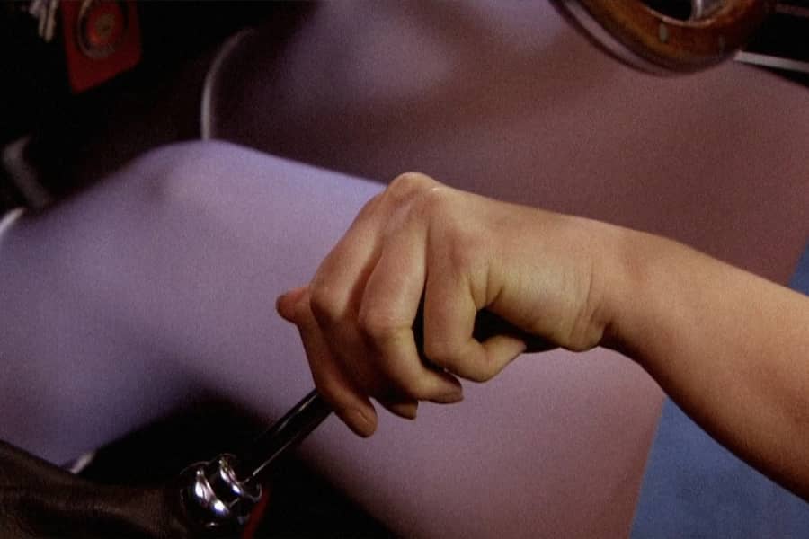 a hand on the stick shift