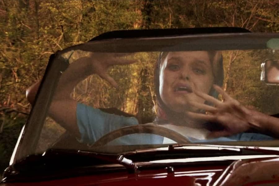 Stella with her hands in front of her face, about to crash
