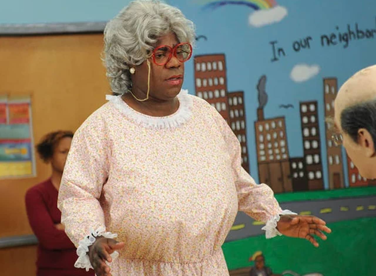 Tracy Jordan as Aunt Phatso in grey wig, red glasses, and grandma dress