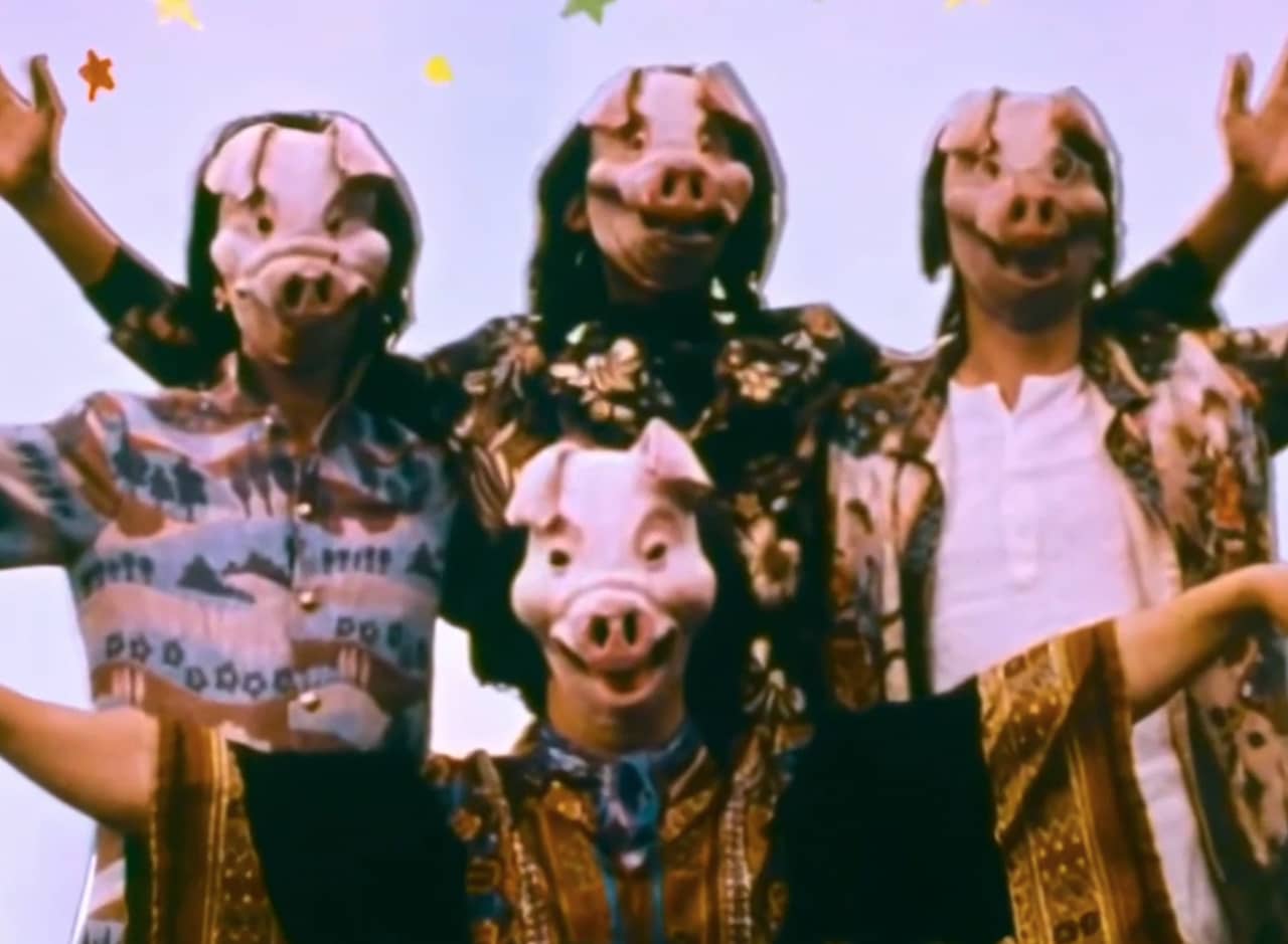 the Rutles wearing pig masks