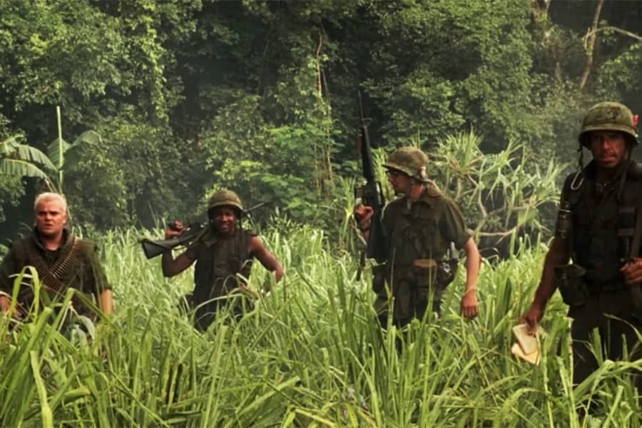 American soldiers walking through the Vietnam jungle