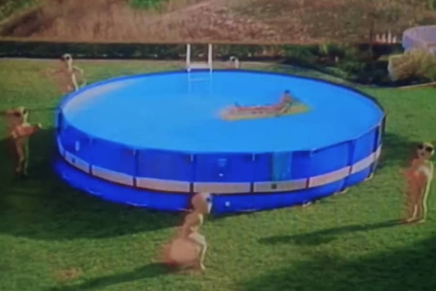 aliens playing in an above ground pool