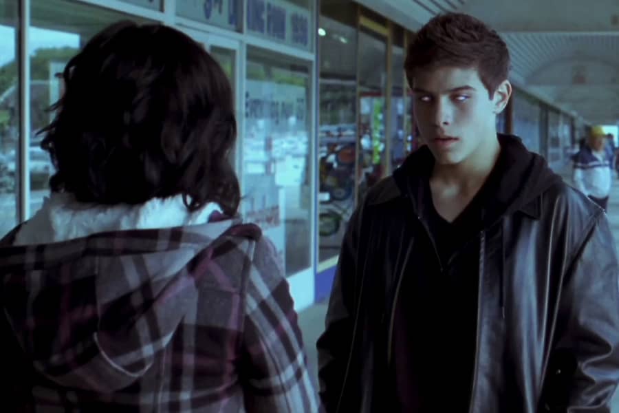 Rochelle talking to a boy with fully white eyes