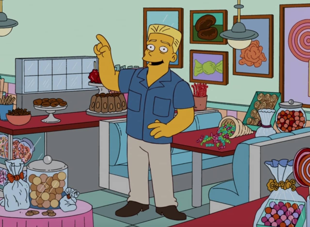 Huel Howser surrounded by sweets and treats