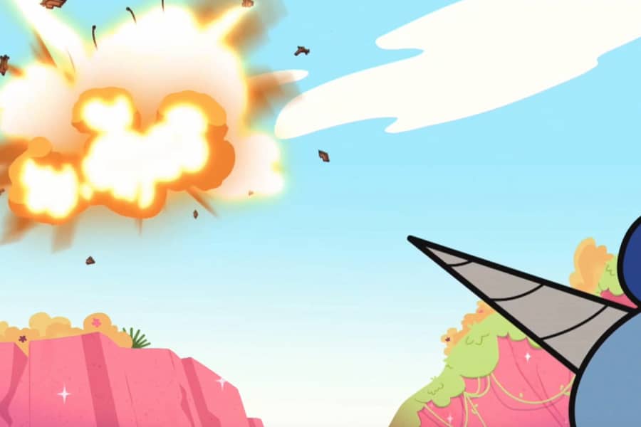 a unicorn horn pointed at an explosion in the sky