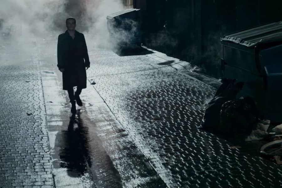 Ramsey walks down a foggy, dark alley