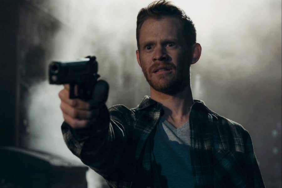 man lowers his gun in disbelief