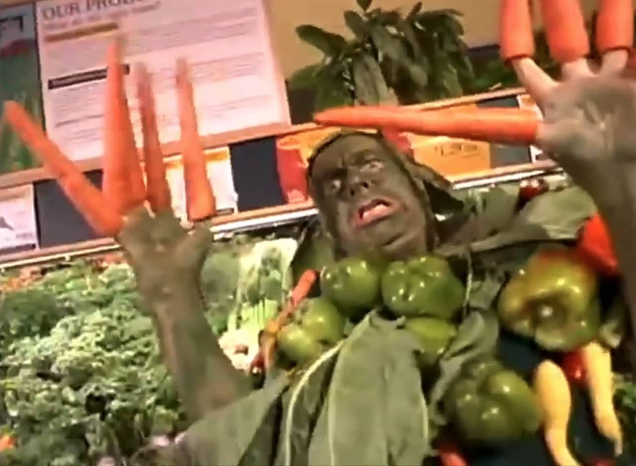 vegetable man, a scary man covered in veggies, in the grocery store