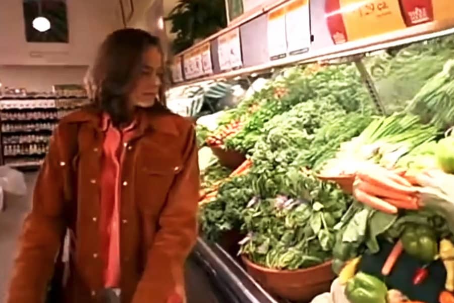 woman browsing vegetables at the grocery store