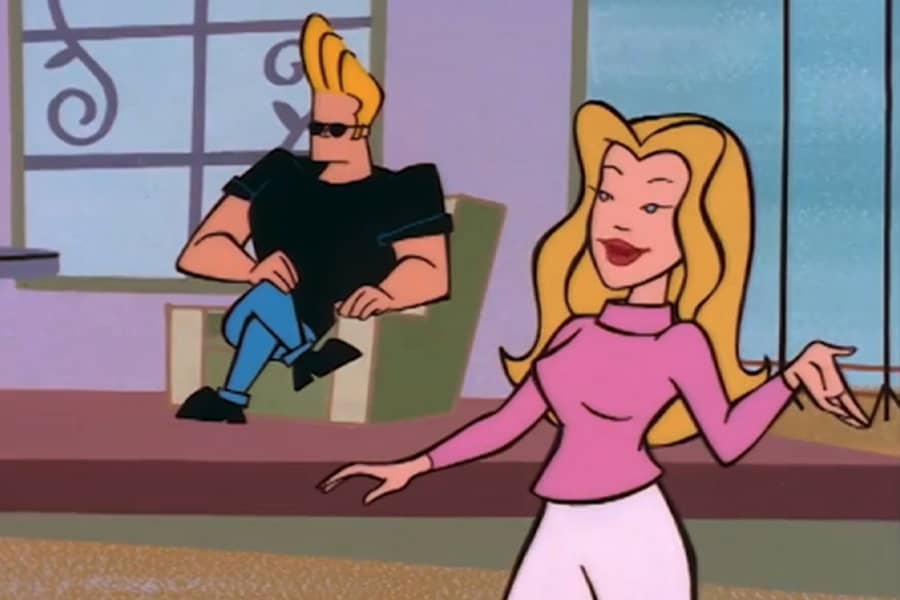 Vendela with Johnny Bravo sitting on a chair on set