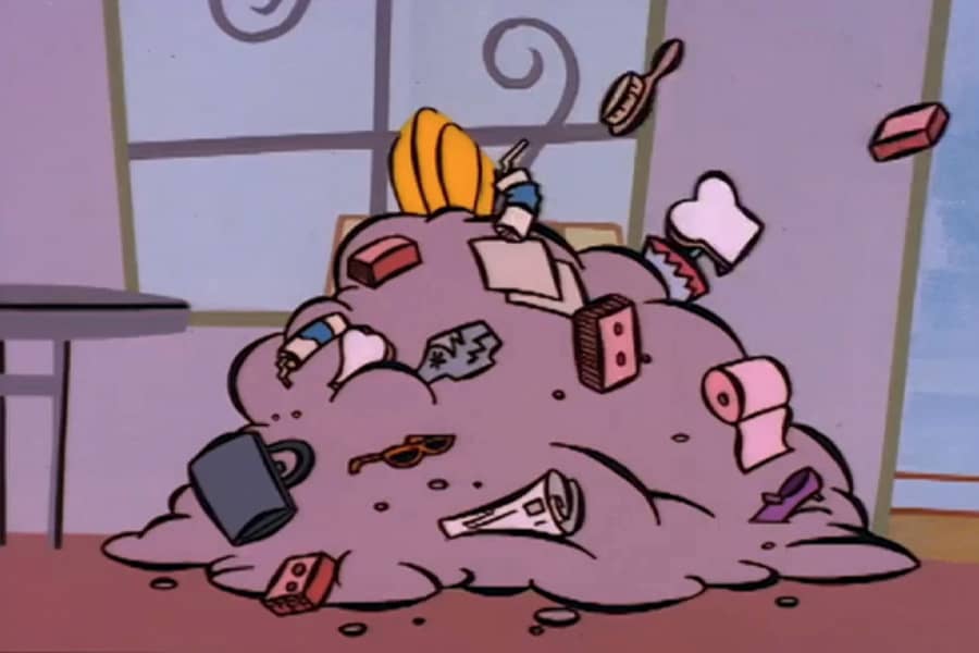 Johnny Bravo covered in trash thrown from the audience