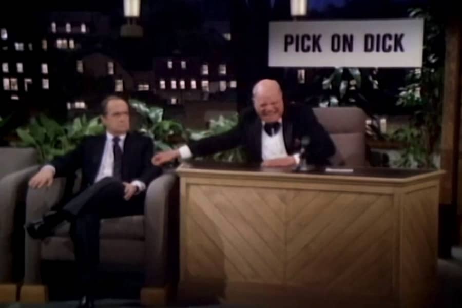 Prince with Dick Loudon and a sign that says “pick on Dick”