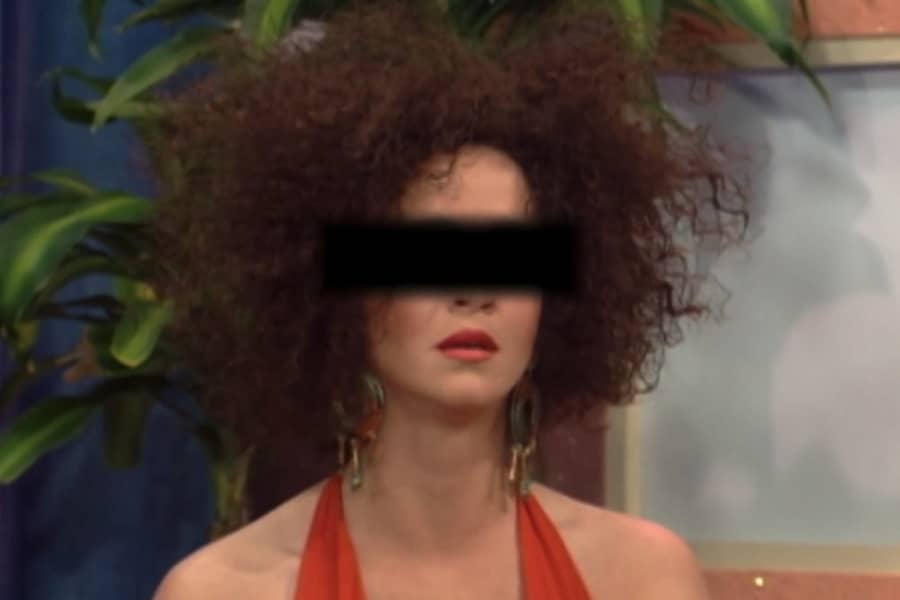 a girl with a bad perm and black bar covering her eyes
