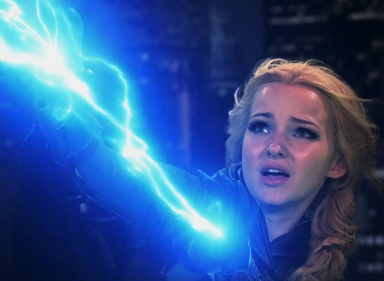 Tess, a blonde teenager, shooting blue lightning from her hands