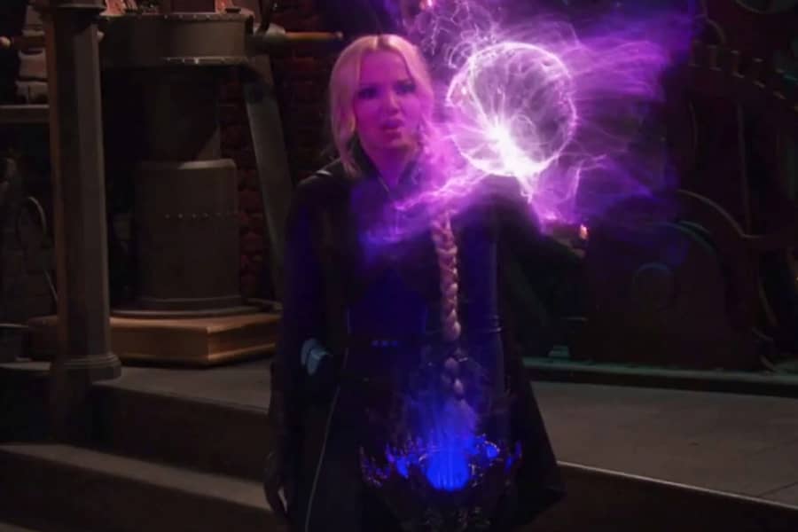 Tess looking at a floating purple electrical orb