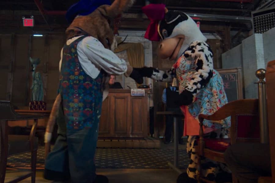 two people in animal costumes in the courtroom