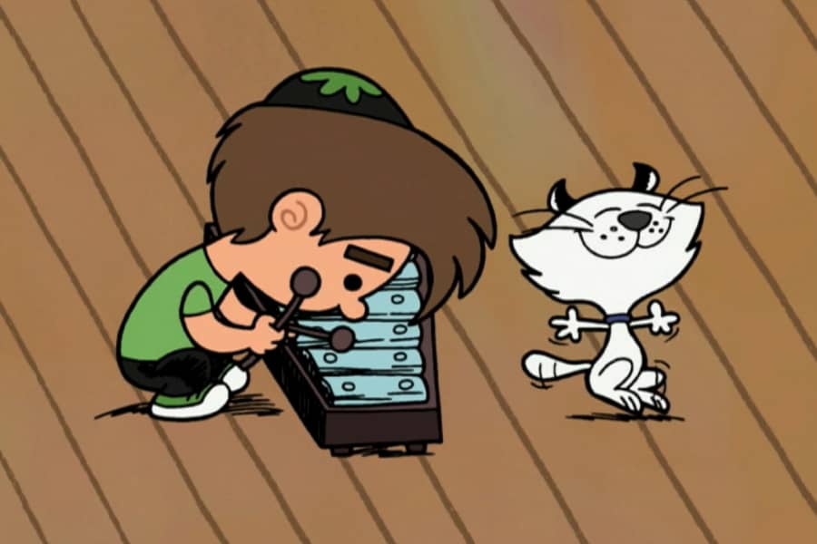 kid in yarmulke playing a xylophone with a cat dancing nearby