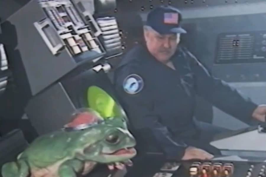 a man and Walter in a spaceship cockpit