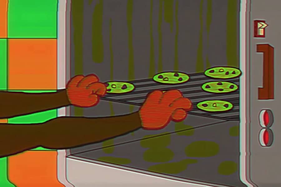 Teddy’s hands are bright red as they grab food from the oven