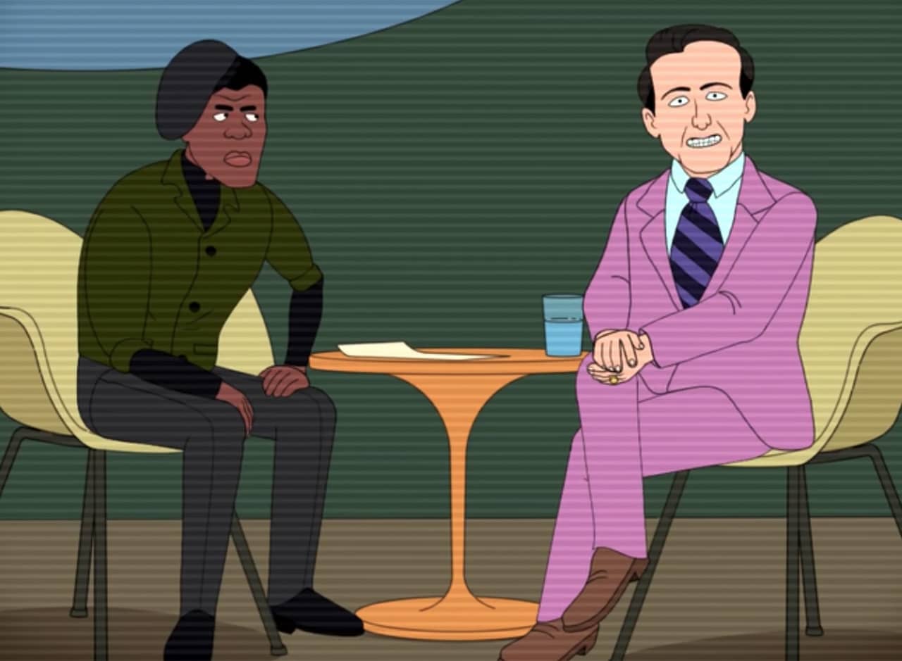 Jim Jeffords in a purple suit, grinning like a dork, next to a Black revolutionary
