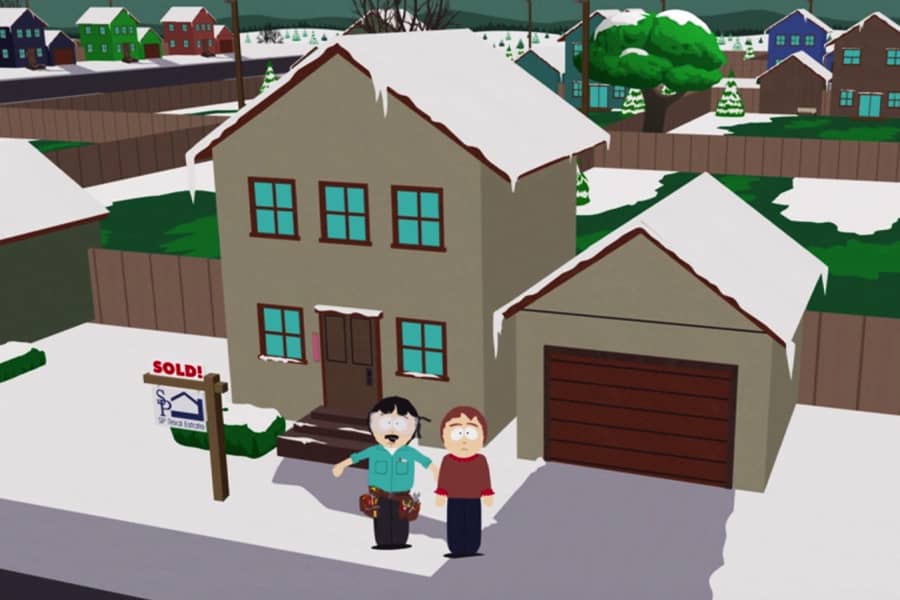 Randy and Sharon Marsh standing outside a house that has recently sold