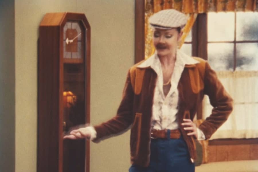 Deborah dressed as a man with a fake mustache