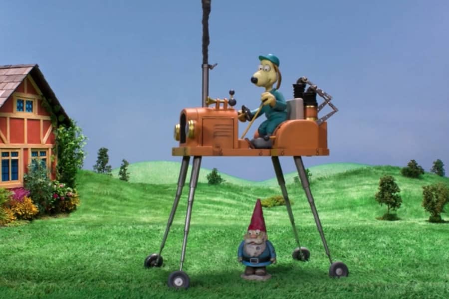 Crumble drives a machine over a garden gnome