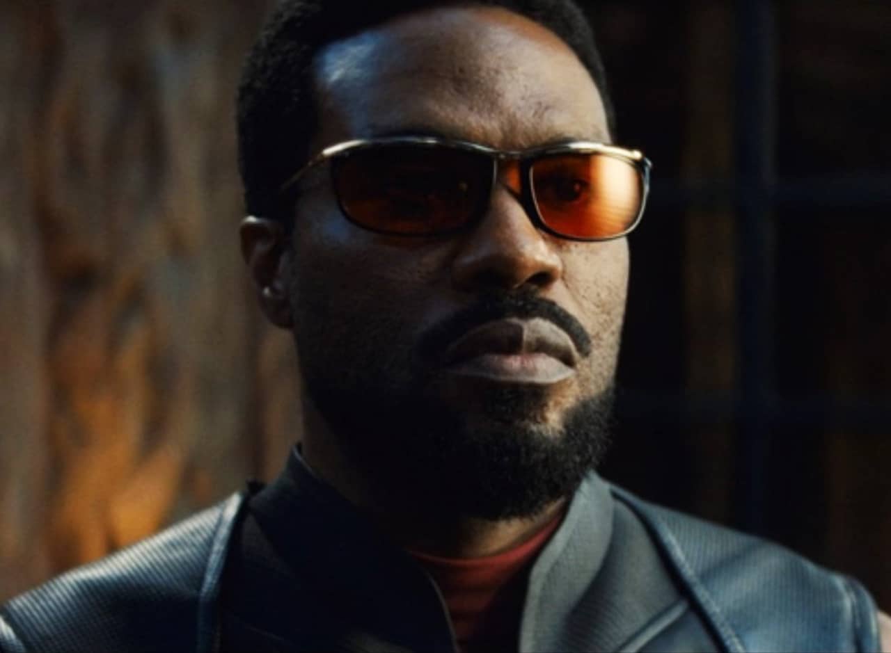 Wonder Man, a black superhero with red-tinted glasses