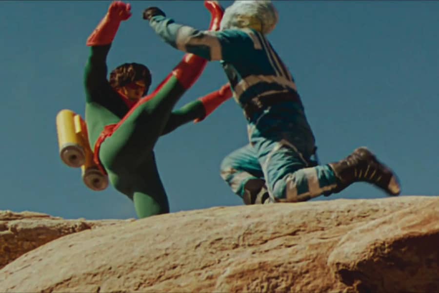 Wonder Man kicking an alien in the face