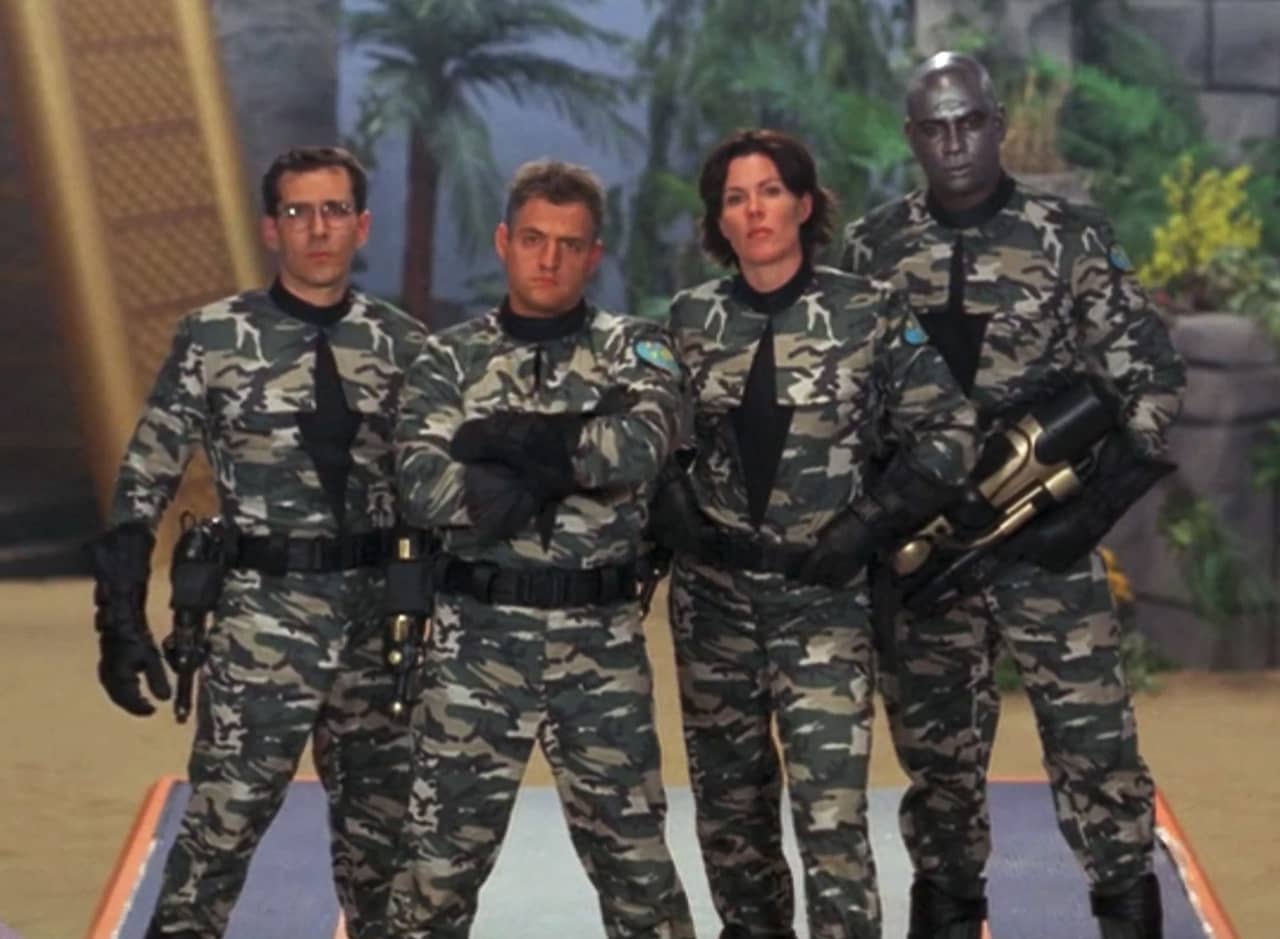 four soldiers in camouflage uniforms