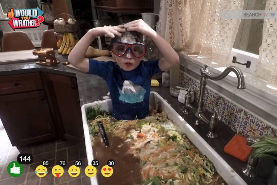 their little brother, Ollie, in the sink filled with the leftovers