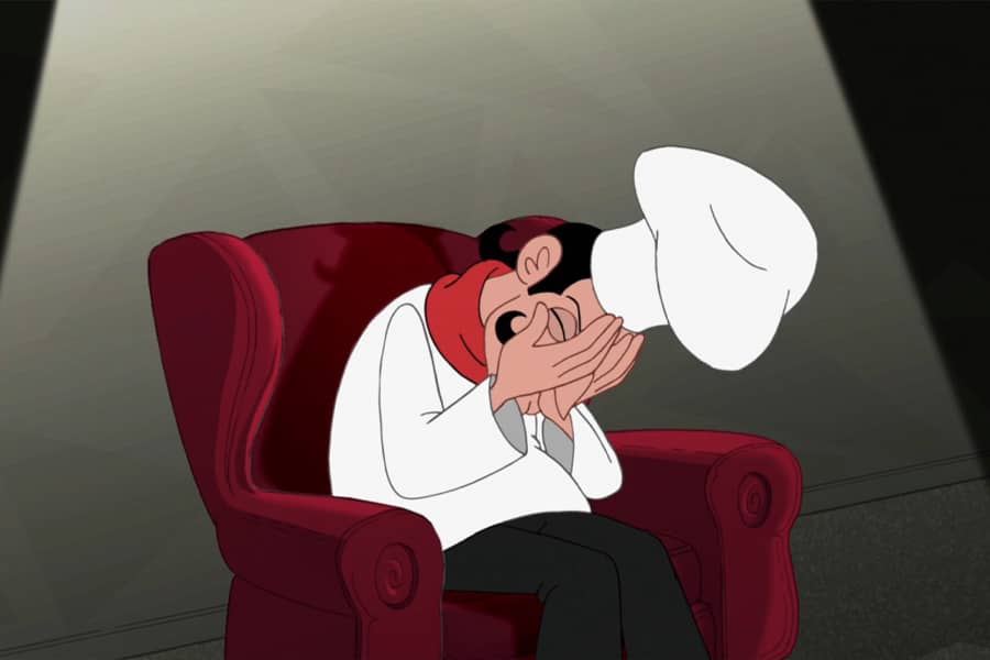 Guilbaud crying in a chair