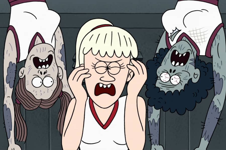 cheerleader screams as two zombie cheerleaders dangle upside down and surround her